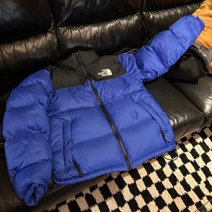 The North Face blue black puffer zip up jacket